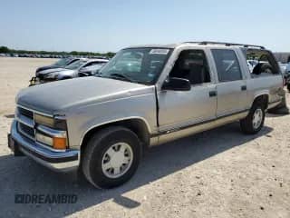 1998 Chevrolet Suburban with VIN 3GNEC16R0WG116738, listed as a Copart auction lot 56048935 with 157,162 mi miles and Salvage title. Bid and sale history available at DreamBid. Image 1.