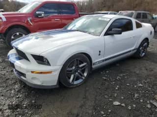 2009 Ford Mustang Shelby GT500 z VIN 1ZVHT88S295130535, wystawiony jako Copart lot #79906214 z przebiegiem 69 646 mil mil oraz Szkoda całkowita • Salvage title. Historia ofert i sprzedaży dostępna na DreamBid. Obrazek 1.