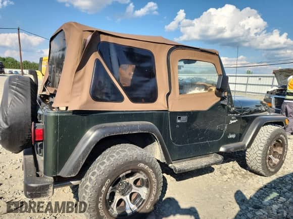 1997 Jeep Wrangler Sport with VIN 1J4FY19S0VP430844, listed as a Copart auction lot 65827275 with 91,868 mi miles and Salvage title. Bid and sale history available at DreamBid. Image 3.