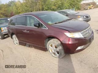 2012 Honda Odyssey Touring с VIN 5FNRL5H95CB061512, выставлен на аукционе IAAI как лот 43344388 с пробегом Не указан миль и . История ставок и продаж доступна на DreamBid. Изображение 1.