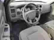 2007 Dodge Dakota SLT с VIN 1D7HW42PX7S138328, выставлен на аукционе Copart как лот 84390095 с пробегом 98 279 миль миль и Списание • Salvage title. История ставок и продаж доступна на DreamBid. Изображение 8.