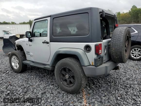 2012 Jeep Wrangler Sport z VIN 1C4AJWAG6CL228765, wystawiony jako Copart lot #80979855 z przebiegiem 216 434 mil mil oraz Szkoda całkowita • Salvage title. Historia ofert i sprzedaży dostępna na DreamBid. Obrazek 2.