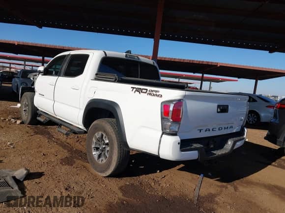 2021 Toyota Tacoma SR5 with VIN 3TMAZ5CN7MM153055, listed as a IAAI auction lot 41350066 with 33,064 mi miles and . Bid and sale history available at DreamBid. Image 3.