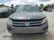 2013 Volkswagen Tiguan SE z VIN WVGAV3AX4DW581925, wystawiony jako Copart lot #55970105 z przebiegiem 115 504 mil mil oraz Czysty tytuł • Clean title. Historia ofert i sprzedaży dostępna na DreamBid. Obrazek 5.