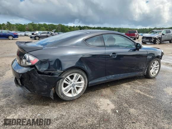 2007 Hyundai Tiburon GS с VIN KMHHM66DX7U250719, выставлен на аукционе Copart как лот 64951335 с пробегом 208 422 миль миль и Списание • Salvage title. История ставок и продаж доступна на DreamBid. Изображение 3.