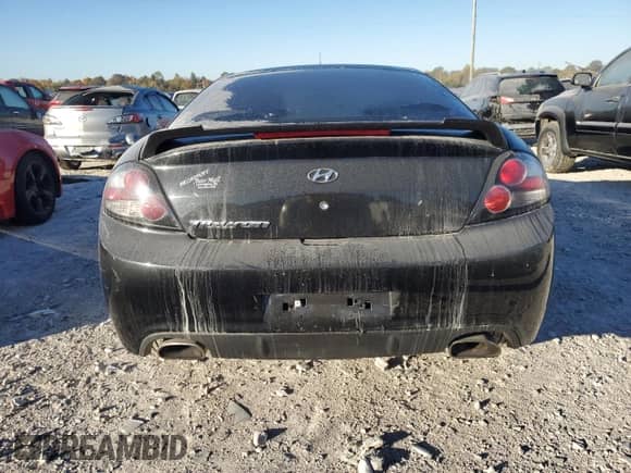 2008 Hyundai Tiburon GS with VIN KMHHM66DX8U291983, listed as a Copart auction lot 74586874 with 111,572 mi miles and Salvage title. Bid and sale history available at DreamBid. Image 6.