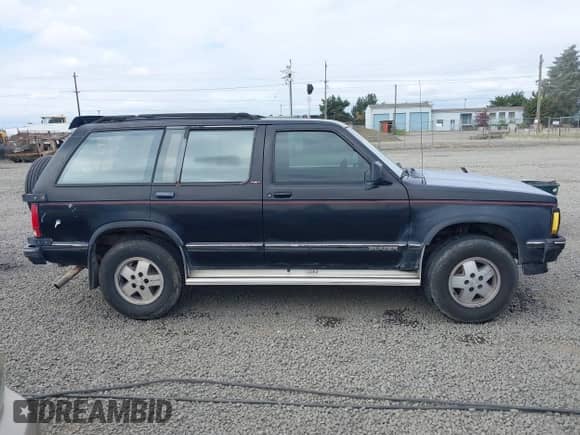 1992 Chevrolet Blazer z VIN 1GNDT13W4N2177782, wystawiony jako IAAI lot #42766017 z przebiegiem 165 544 mil mil oraz . Historia ofert i sprzedaży dostępna na DreamBid. Obrazek 13.