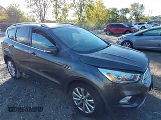 2017 Ford Escape Titanium with VIN 1FMCU9J94HUB03828, listed as a IAAI auction lot 43336898 with 164,743 mi miles and . Bid and sale history available at DreamBid. Image 1.