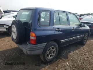 2001 Chevrolet Tracker z VIN 2CNBJ13C616955326, wystawiony jako Copart lot #64105184 z przebiegiem 138 156 mil mil oraz Czysty tytuł • Clean title. Historia ofert i sprzedaży dostępna na DreamBid. Obrazek 3.