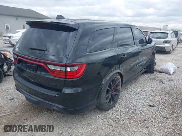 2021 Dodge Durango SRT Hellcat with VIN 1C4SDJH91MC682235, listed as a IAAI auction lot 42029380 with 9,921 mi miles and . Bid and sale history available at DreamBid. Image 4.