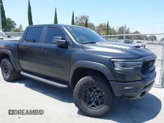 2023 Ram 1500 TRX z VIN 1C6SRFU93PN571514, wystawiony jako IAAI lot #42593363 z przebiegiem 14 653 mil mil oraz . Historia ofert i sprzedaży dostępna na DreamBid. Obrazek 1.