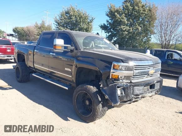 2016 Chevrolet Silverado 2500HD High Country z VIN 1GC1KXE89GF283916, wystawiony jako IAAI lot #41202088 z przebiegiem 182 756 mil mil oraz . Historia ofert i sprzedaży dostępna na DreamBid. Obrazek 1.