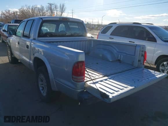 2004 Dodge Dakota Sport with VIN 1D7HL38K84S713231, listed as a IAAI auction lot 41371750 with 269,415 mi miles and . Bid and sale history available at DreamBid. Image 3.