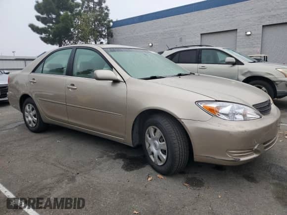 2004 Toyota Camry LE с VIN JTDBE32K540245988, выставлен на аукционе Copart как лот 85377585 с пробегом 137 147 миль миль и Списание • Salvage title. История ставок и продаж доступна на DreamBid. Изображение 4.