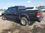 2003 Dodge Dakota Sport with VIN 1D7HG38XX3S334391, listed as a Copart auction lot 66194715 with 100,939 mi miles and Salvage title. Bid and sale history available at DreamBid. Image 2.