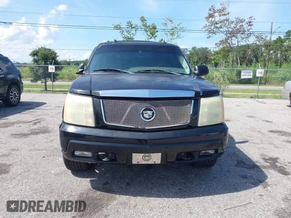 2004 Cadillac Escalade z VIN 1GYEK63N34R265999, wystawiony jako IAAI lot #42963339 z przebiegiem 156 962 mil mil oraz . Historia ofert i sprzedaży dostępna na DreamBid. Obrazek 6.