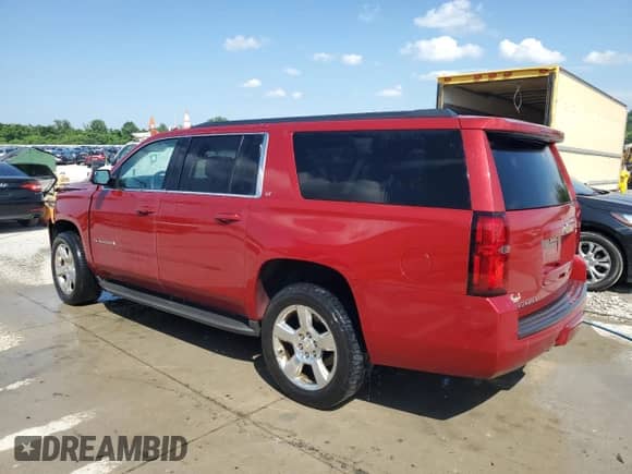 2015 Chevrolet Suburban LT with VIN 1GNSKJKC2FR643607, listed as a Copart auction lot 63677675 with 151,061 mi miles and Salvage title. Bid and sale history available at DreamBid. Image 2.