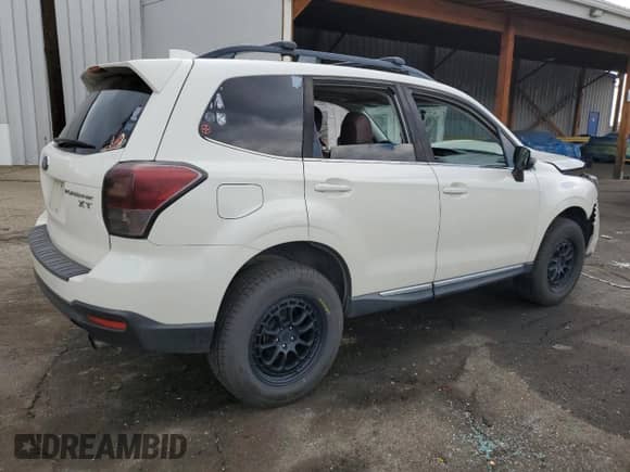 2017 Subaru Forester Touring z VIN JF2SJGTC9HH412677, wystawiony jako Copart lot #68206405 z przebiegiem 130 892 mil mil oraz Szkoda całkowita • Salvage title. Historia ofert i sprzedaży dostępna na DreamBid. Obrazek 3.