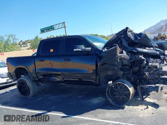 2021 Ram 1500 Laramie with VIN 1C6SRFJTXMN823383, listed as a IAAI auction lot 43353162 with 82,117 mi miles and . Bid and sale history available at DreamBid. Image 12.