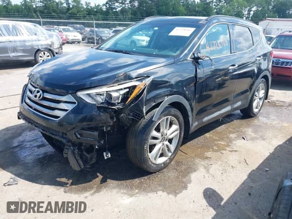 2015 Hyundai Santa Fe with VIN 5XYZW4LA4FG245064, listed as a IAAI auction lot 42728103 with 199,284 mi miles and . Bid and sale history available at DreamBid. Image 2.