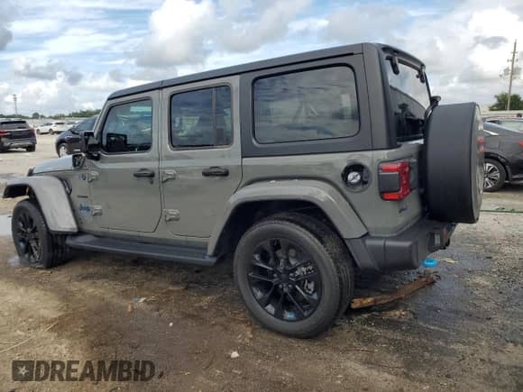 2023 Jeep Wrangler Sahara с VIN 1C4JJXP67PW605290, выставлен на аукционе Copart как лот 85527815 с пробегом Не указан миль и На запчасти • Non repairable. История ставок и продаж доступна на DreamBid. Изображение 2.