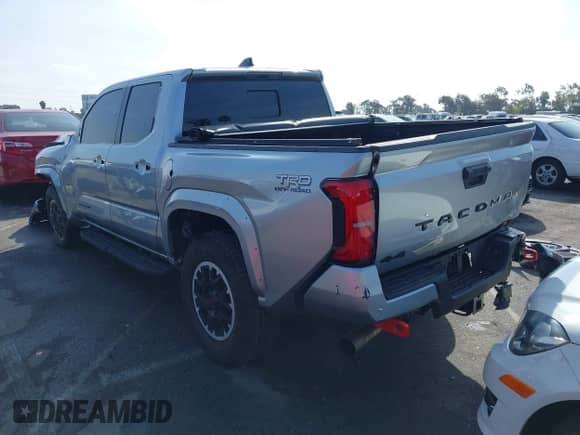 2024 Toyota Tacoma SR5 with VIN 3TMLB5JN6RM022612, listed as a IAAI auction lot 41611378 with 7,275 mi miles and . Bid and sale history available at DreamBid. Image 3.