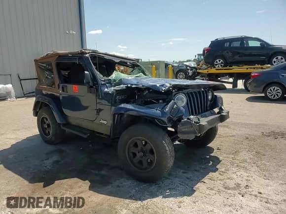 2003 Jeep Wrangler X z VIN 1J4FA39S43P357281, wystawiony jako Copart lot #67979335 z przebiegiem Nie podano mil oraz Szkoda całkowita • Salvage title. Historia ofert i sprzedaży dostępna na DreamBid. Obrazek 13.