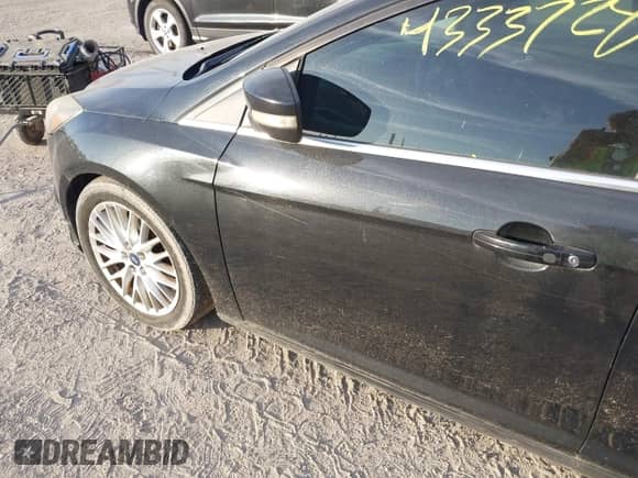 2014 Ford Focus Titanium with VIN 1FADP3J22EL263701, listed as a IAAI auction lot 43337282 with 158,977 mi miles and . Bid and sale history available at DreamBid. Image 6.