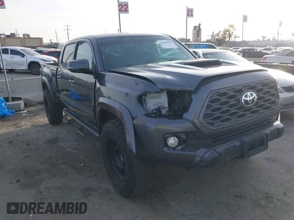 2021 Toyota Tacoma SR5 z VIN 3TMDZ5BN2MM108586, wystawiony jako IAAI lot #41604953 z przebiegiem 65 422 mil mil oraz . Historia ofert i sprzedaży dostępna na DreamBid. Obrazek 1.