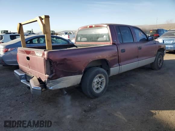 2000 Dodge Dakota Sport z VIN 1B7GL2AN1YS608072, wystawiony jako Copart lot #83624164 z przebiegiem 171 499 mil mil oraz Szkoda całkowita • Salvage title. Historia ofert i sprzedaży dostępna na DreamBid. Obrazek 3.