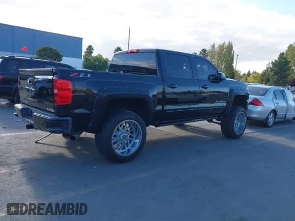 2018 Chevrolet Silverado 1500 LT with VIN 3GCUKRECXJG264567, listed as a IAAI auction lot 43422265 with 83,551 mi miles and . Bid and sale history available at DreamBid. Image 4.