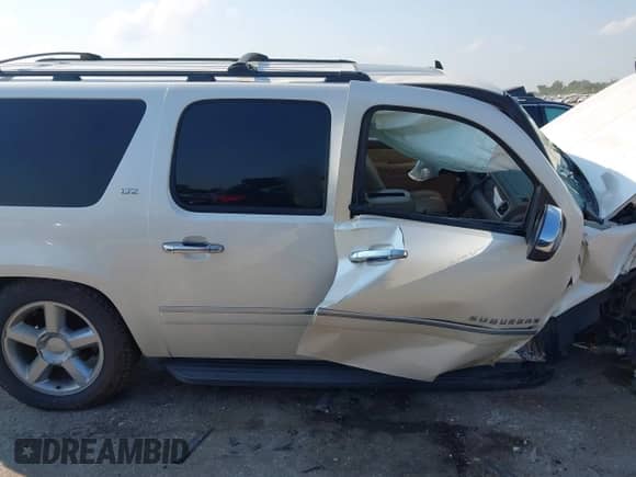 2013 Chevrolet Suburban LTZ with VIN 1GNSCKE03DR252662, listed as a IAAI auction lot 43209732 with 146,502 mi miles and . Bid and sale history available at DreamBid. Image 12.