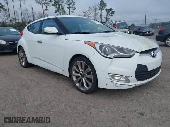 2014 Hyundai Veloster z VIN KMHTC6ADXEU213073, wystawiony jako IAAI lot #41551346 z przebiegiem 130 549 mil mil oraz . Historia ofert i sprzedaży dostępna na DreamBid. Obrazek 1.