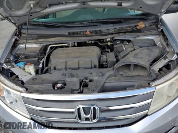 2013 Honda Odyssey LX z VIN 5FNRL5H27DB052198, wystawiony jako Copart lot #85646085 z przebiegiem 130 530 mil mil oraz Szkoda całkowita • Salvage title. Historia ofert i sprzedaży dostępna na DreamBid. Obrazek 12.