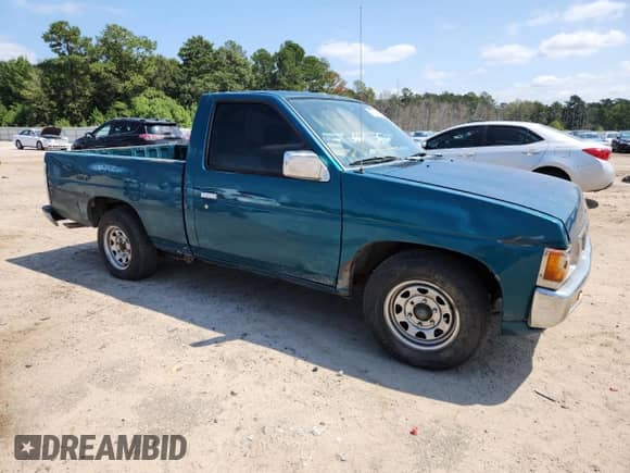 1995 Nissan Frontier with VIN 1N6SD11S3SC358078, listed as a Copart auction lot 71859815 with 118,833 mi miles and Salvage title. Bid and sale history available at DreamBid. Image 4.