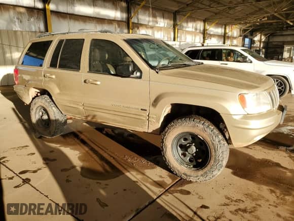 2000 Jeep Grand Cherokee Limited z VIN 1J4GW58N0YC419352, wystawiony jako Copart lot #86405605 z przebiegiem 211 579 mil mil oraz Czysty tytuł • Clean title. Historia ofert i sprzedaży dostępna na DreamBid. Obrazek 4.