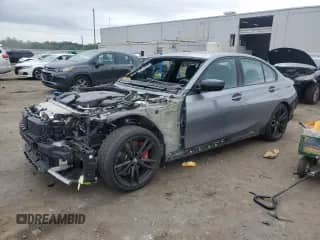 2023 BMW 3 Series 330i z VIN 3MW69FF04P8D40131, wystawiony jako Copart lot #67677535 z przebiegiem 11 699 mil mil oraz Szkoda całkowita • Salvage title. Historia ofert i sprzedaży dostępna na DreamBid. Obrazek 1.