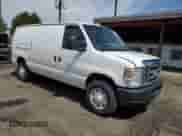 2014 Ford Econoline Cargo Commercial with VIN 1FTNE2EW3EDA33705, listed as a Copart auction lot 60919935 with 174,371 mi miles and Salvage title. Bid and sale history available at DreamBid. Image 4.
