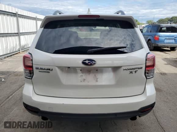2017 Subaru Forester Touring z VIN JF2SJGWCXHH453105, wystawiony jako Copart lot #70501345 z przebiegiem 146 190 mil mil oraz Szkoda całkowita • Salvage title. Historia ofert i sprzedaży dostępna na DreamBid. Obrazek 6.