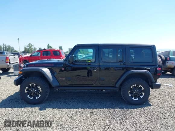 2024 Jeep Wrangler Rubicon z VIN 1C4PJXFG0RW321491, wystawiony jako IAAI lot #42461809 z przebiegiem 10 419 mil mil oraz . Historia ofert i sprzedaży dostępna na DreamBid. Obrazek 14.