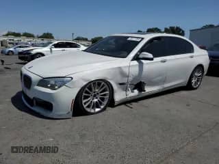 2014 BMW 7 Series 740Li with VIN WBAYE4C56ED138402, listed as a Copart auction lot 59127205 with 103,829 mi miles and Salvage title. Bid and sale history available at DreamBid. Image 1.