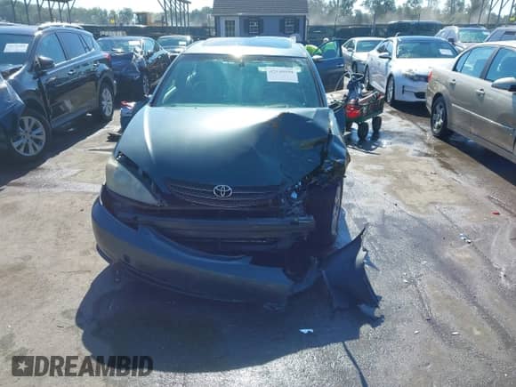 2004 Toyota Camry LE with VIN JTDBE32K540247403, listed as a IAAI auction lot 43148950 with 173,829 mi miles and . Bid and sale history available at DreamBid. Image 13.