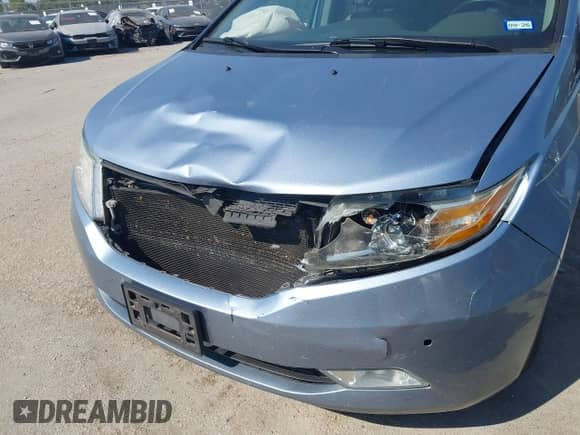 2012 Honda Odyssey Touring with VIN 5FNRL5H97CB130670, listed as a IAAI auction lot 43438076 with 198,047 mi miles and . Bid and sale history available at DreamBid. Image 6.