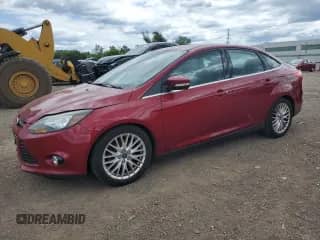 2014 Ford Focus Titanium with VIN 1FADP3J26EL227901, listed as a Copart auction lot 70023645 with 68,796 mi miles and Salvage title. Bid and sale history available at DreamBid. Image 1.