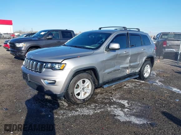 2017 Jeep Grand Cherokee Laredo with VIN 1C4RJEAG3HC890386, listed as a IAAI auction lot 41790836 with 67,166 mi miles and . Bid and sale history available at DreamBid. Image 2.