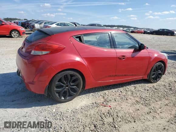 2013 Hyundai Veloster w/Black Int z VIN KMHTC6AD9DU106353, wystawiony jako Copart lot #82602835 z przebiegiem 115 712 mil mil oraz Czysty tytuł • Clean title. Historia ofert i sprzedaży dostępna na DreamBid. Obrazek 3.