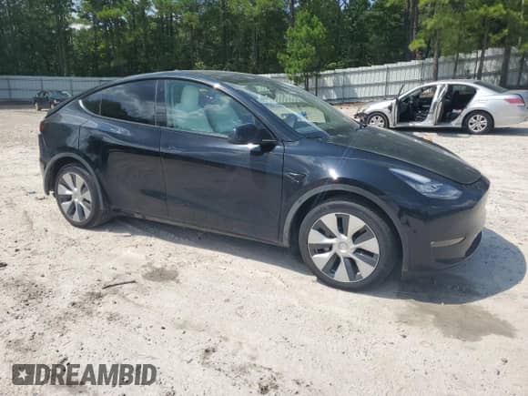 2022 Tesla Model Y Long Range with VIN 7SAYGDEE9NF455340, listed as a Copart auction lot 66966654 with 22,707 mi miles and Salvage title. Bid and sale history available at DreamBid. Image 4.