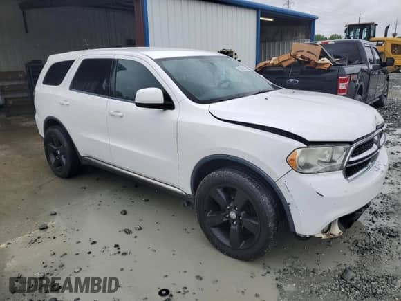 2013 Dodge Durango SXT with VIN 1C4RDHAG6DC667648, listed as a Copart auction lot 53053315 with 235,338 mi miles and Salvage title. Bid and sale history available at DreamBid. Image 4.