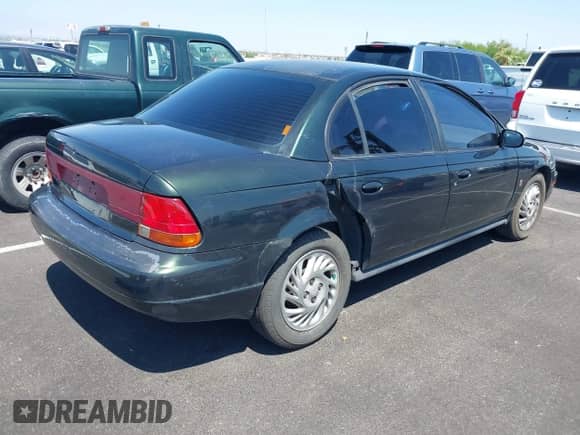 1999 Saturn SL z VIN 1G8ZK5274XZ304652, wystawiony jako IAAI lot #42618620 z przebiegiem 98 131 mil mil oraz . Historia ofert i sprzedaży dostępna na DreamBid. Obrazek 6.