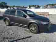 2014 Dodge Journey SXT with VIN 3C4PDCBG9ET142064, listed as a Copart auction lot 84588885 with 168,463 mi miles and Salvage title. Bid and sale history available at DreamBid. Image 4.
